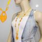 Preview: Kette 55x35mm Faustkeil Kunststoff gelb-orange-marmoriert Kordel gelb 90cm